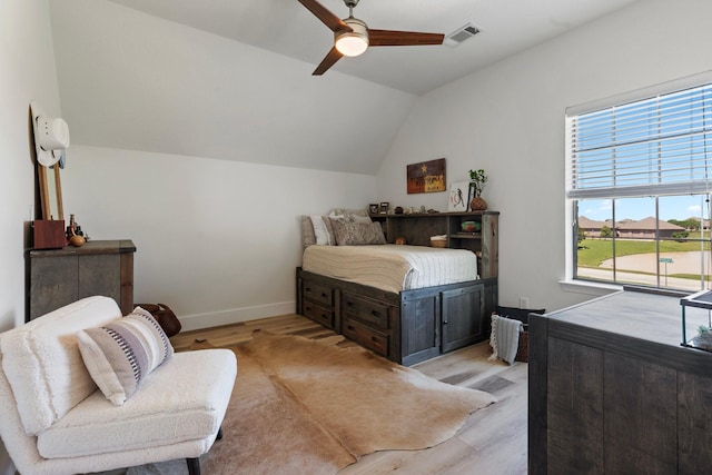 26719 Outback Dr, Katy, TX 77493 - bedroom featuring ceiling fan, visible vents, lofted ceiling, light wood finished floors, and baseboards