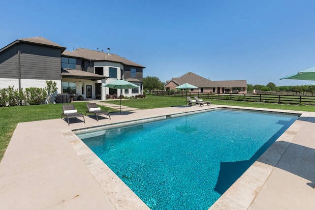 26719 Outback Dr, Katy, TX 77493 - view of swimming pool with a yard, fence, a fenced in pool, and a patio area