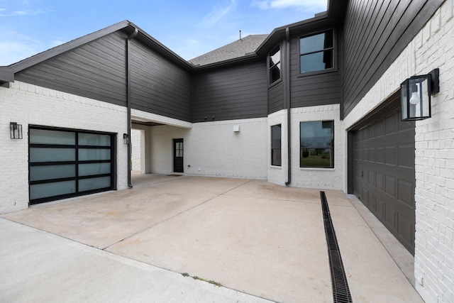 26719 Outback Dr, Katy, TX 77493 - exterior space with concrete driveway and brick siding