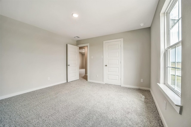 1014 Wildflower Way Dr, Beasley, TX 77417 - unfurnished bedroom featuring carpet, baseboards, and a closet