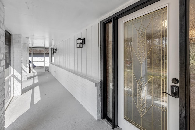 doorway to property featuring covered porch