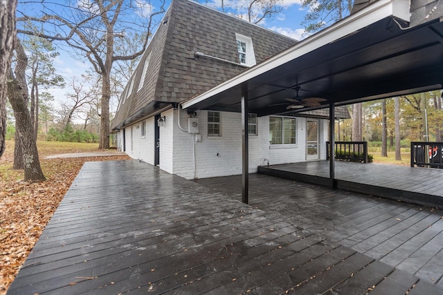 wooden deck featuring ceiling fan