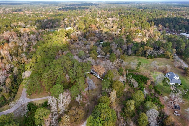 drone / aerial view featuring a view of trees