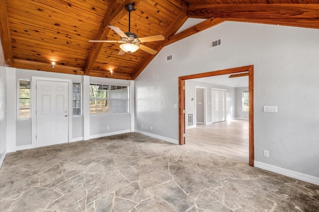 interior space with stone floors, visible vents, wooden ceiling, and high vaulted ceiling