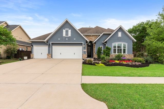 6931 Harvest Ln, Katy, TX 77493 - view of front of house featuring stucco siding, driveway, an attached garage, a front lawn, and fence