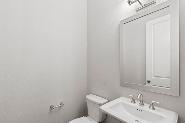 6931 Harvest Ln, Katy, TX 77493 - bathroom featuring a sink and toilet