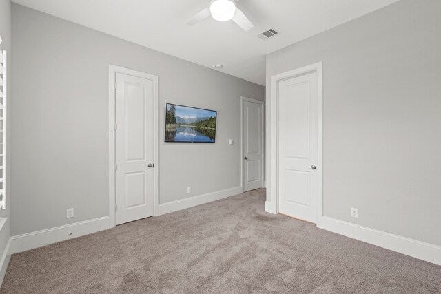 6931 Harvest Ln, Katy, TX 77493 - unfurnished bedroom featuring visible vents, baseboards, ceiling fan, and carpet floors