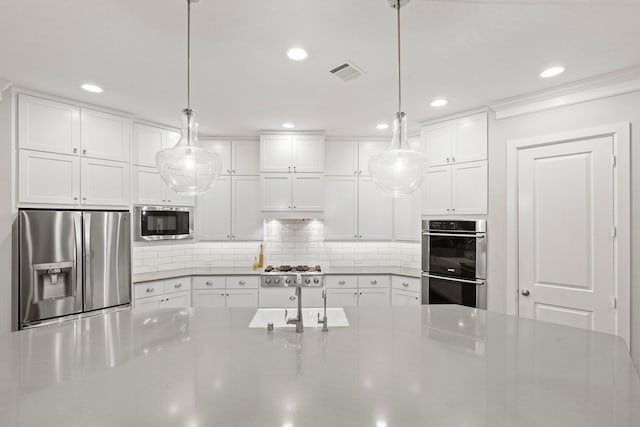 6931 Harvest Ln, Katy, TX 77493 - kitchen featuring recessed lighting, backsplash, white cabinets, visible vents, and stainless steel appliances
