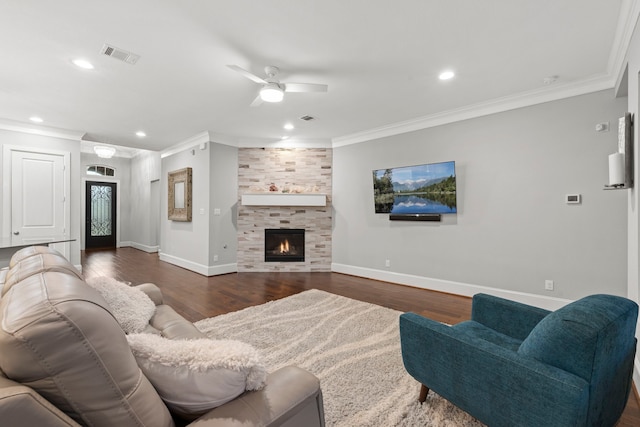 6931 Harvest Ln, Katy, TX 77493 - living room featuring wood finished floors, ornamental molding, a ceiling fan, and visible vents