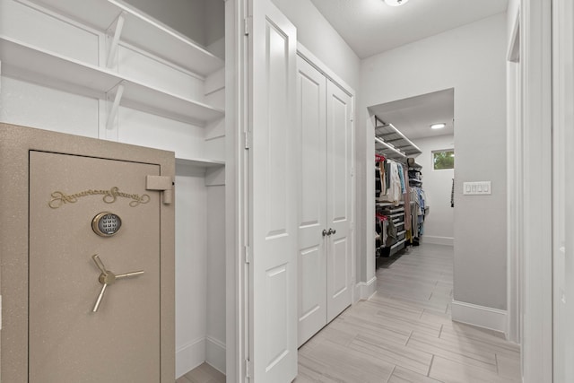 6931 Harvest Ln, Katy, TX 77493 - hallway with baseboards and wood finish floors