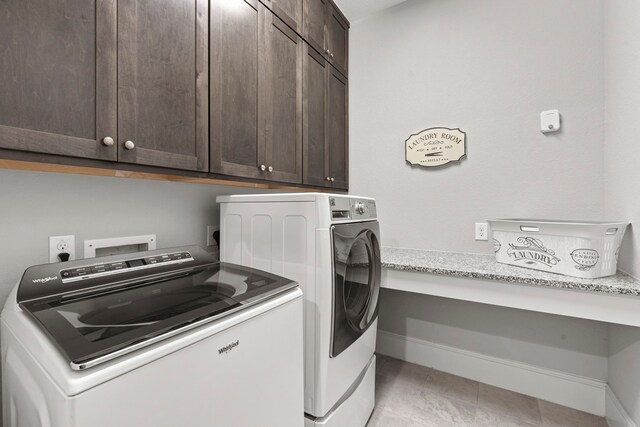 6931 Harvest Ln, Katy, TX 77493 - clothes washing area with cabinet space, washer and clothes dryer, and baseboards