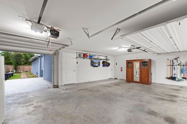 6931 Harvest Ln, Katy, TX 77493 - garage featuring a garage door opener