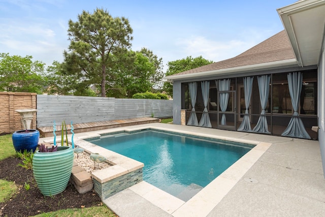 6931 Harvest Ln, Katy, TX 77493 - view of swimming pool with a sunroom, a fenced backyard, a fenced in pool, and a patio area