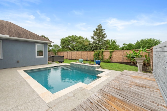 6931 Harvest Ln, Katy, TX 77493 - view of swimming pool with a wooden deck, a hot tub, a fenced backyard, a lawn, and a fenced in pool