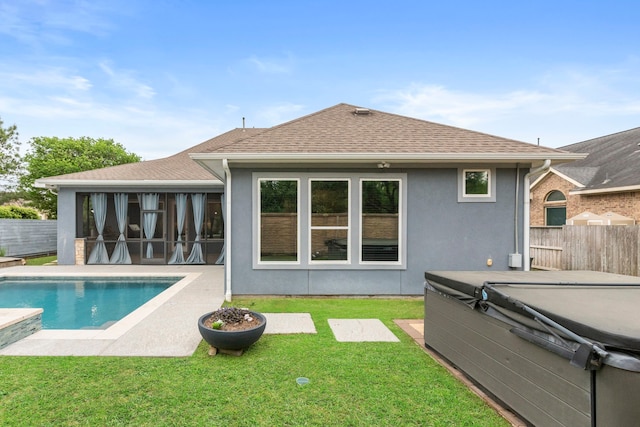 6931 Harvest Ln, Katy, TX 77493 - rear view of house featuring a yard, a fenced backyard, roof with shingles, and a hot tub