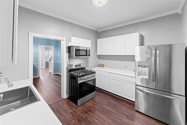 6503 Ave C, Houston, TX 77011 - kitchen with light countertops, appliances with stainless steel finishes, a sink, and ornamental molding