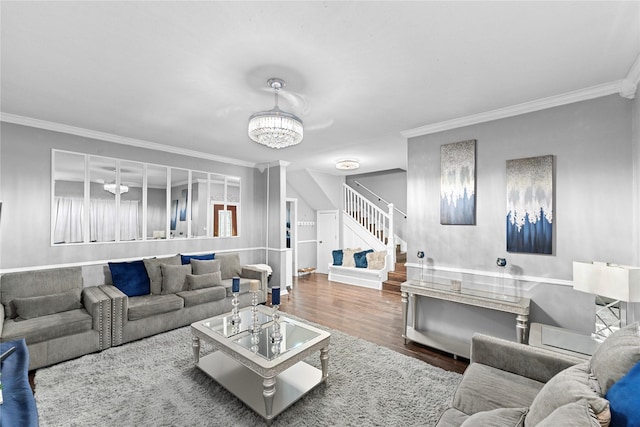 6503 Ave C, Houston, TX 77011 - living room with wood finished floors, a notable chandelier, ornamental molding, and stairway