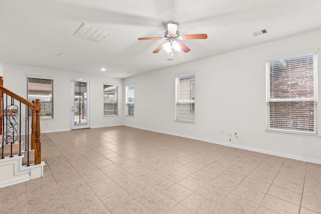 15922 Copper Springs Ln, Houston, TX 77084 - spare room with light tile patterned floors, stairs, visible vents, and a ceiling fan