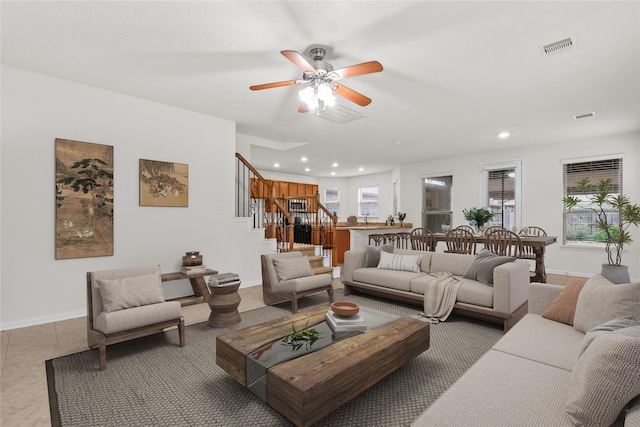 15922 Copper Springs Ln, Houston, TX 77084 - living area with stairs, ceiling fan, recessed lighting, and baseboards