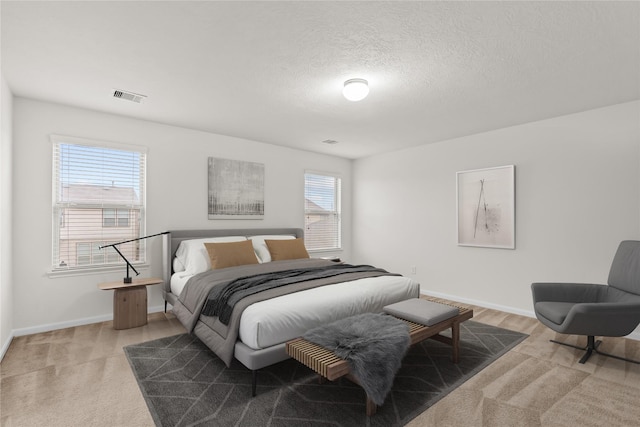 15922 Copper Springs Ln, Houston, TX 77084 - bedroom featuring light carpet, baseboards, and a textured ceiling