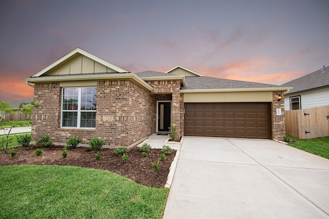 3001 Plains Cir, Brookshire, TX 77423 - single story home with an attached garage, brick siding, concrete driveway, board and batten siding, and a shingled roof