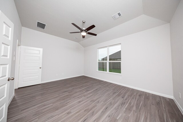 3001 Plains Cir, Brookshire, TX 77423 - spare room with lofted ceiling, a ceiling fan, wood finished floors, and baseboards