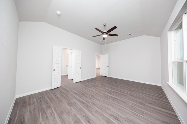 3001 Plains Cir, Brookshire, TX 77423 - unfurnished bedroom featuring lofted ceiling, wood finished floors, baseboards, and ceiling fan