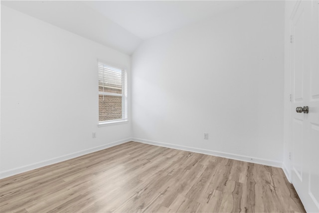 3319 Meadknoll Ln, Richmond, TX 77406 - empty room with light wood-style floors, lofted ceiling, and baseboards
