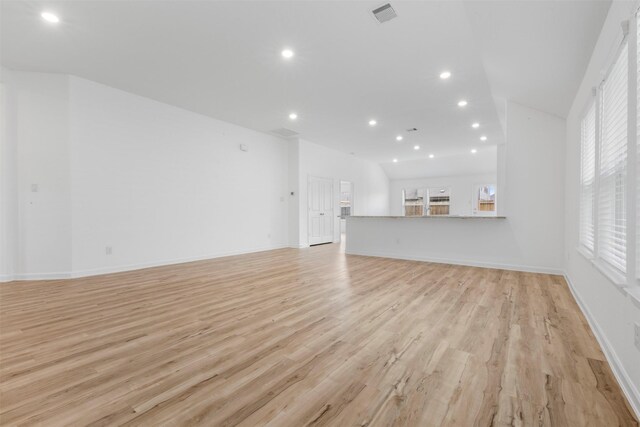 3319 Meadknoll Ln, Richmond, TX 77406 - unfurnished living room with recessed lighting, light wood-style flooring, and baseboards