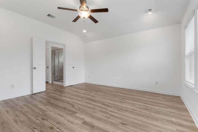 3319 Meadknoll Ln, Richmond, TX 77406 - empty room with a ceiling fan, lofted ceiling, plenty of natural light, and light wood-style floors