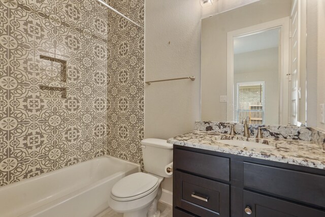 full bathroom featuring shower / bathing tub combination, vanity, and toilet