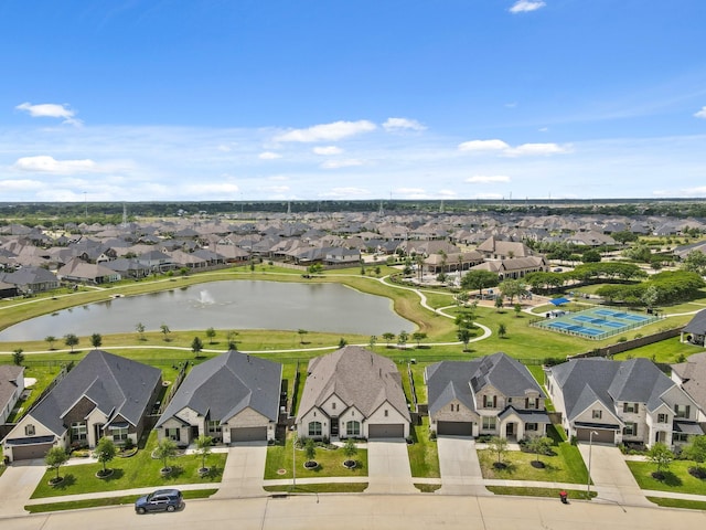 birds eye view of property with a residential view and a water view