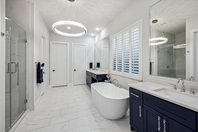 bathroom with a sink, a freestanding bath, marble finish floor, and a stall shower