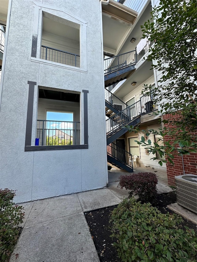 6289 Wilcrest Dr Unit 2203, Houston, TX 77072 - view of building exterior with central air condition unit