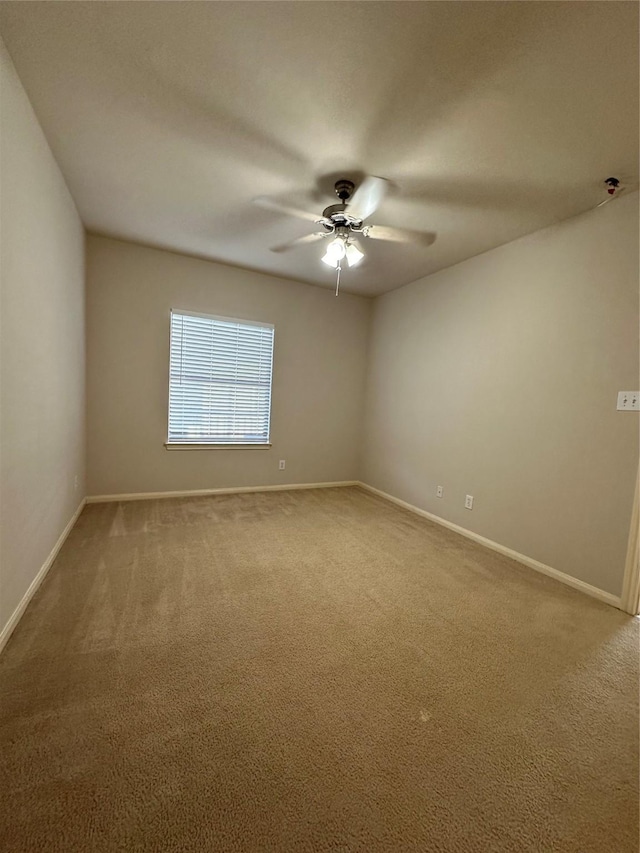 6289 Wilcrest Dr Unit 2203, Houston, TX 77072 - spare room with carpet, baseboards, and a ceiling fan