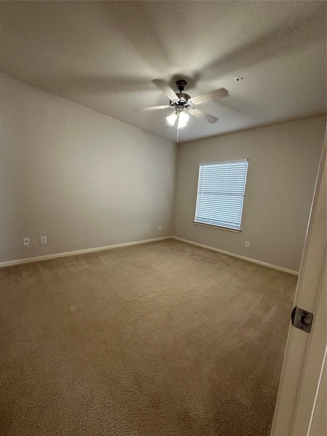 6289 Wilcrest Dr Unit 2203, Houston, TX 77072 - spare room featuring ceiling fan, carpet, baseboards, and a textured ceiling