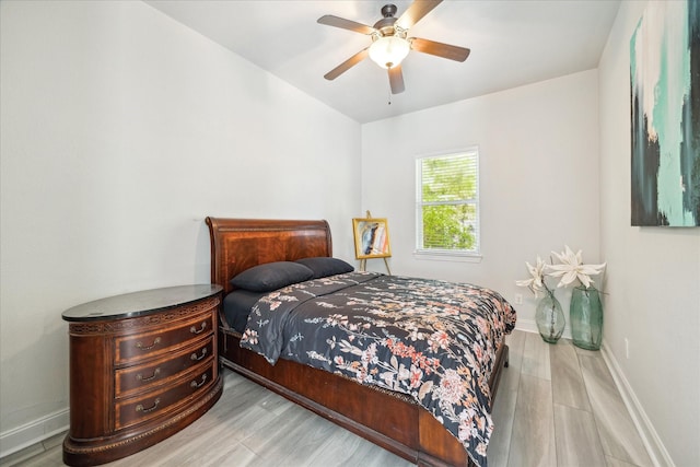 22009 Holly Creek Trl, Tomball, TX 77377 - bedroom with baseboards, a ceiling fan, and wood finished floors