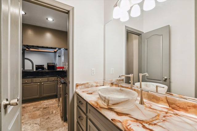 22009 Holly Creek Trl, Tomball, TX 77377 - bathroom with stone finish floor, vanity, and recessed lighting