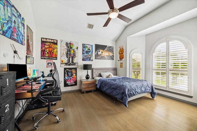 22009 Holly Creek Trl, Tomball, TX 77377 - bedroom with lofted ceiling, visible vents, ceiling fan, and wood finished floors