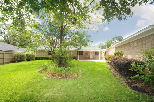 1110 Holly Dr, Conroe, TX 77301 - view of yard with a patio and fence