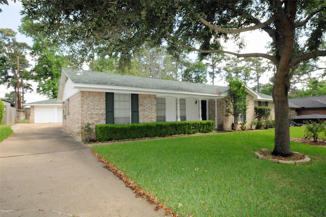 1110 Holly Dr, Conroe, TX 77301 - ranch-style home featuring a garage, roof with shingles, brick siding, and a front yard