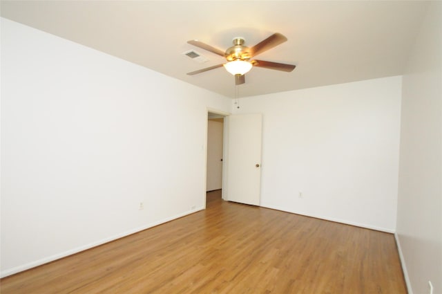 1110 Holly Dr, Conroe, TX 77301 - spare room with visible vents, light wood-style flooring, ceiling fan, and baseboards