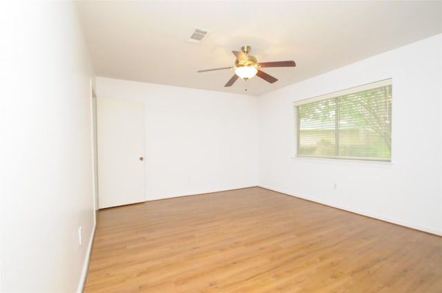1110 Holly Dr, Conroe, TX 77301 - spare room featuring visible vents, light wood finished floors, ceiling fan, and baseboards