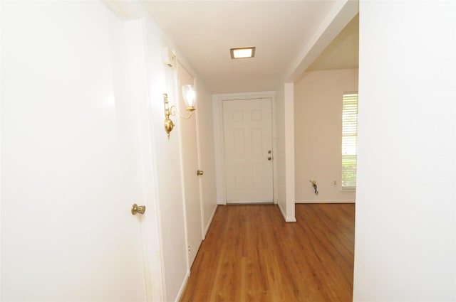 1110 Holly Dr, Conroe, TX 77301 - hall with baseboards and light wood finished floors