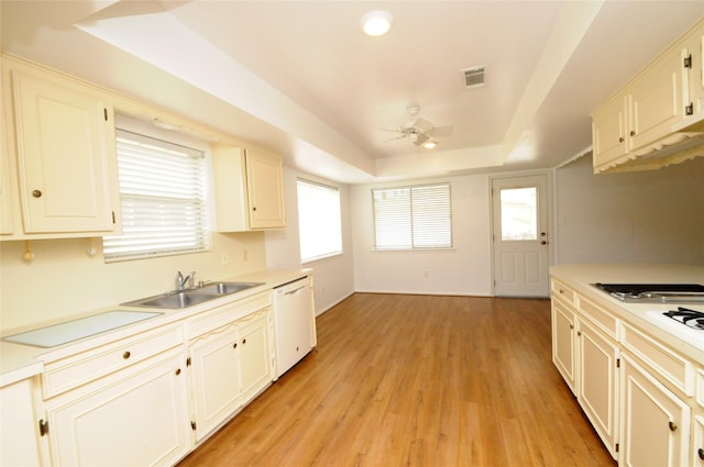 1110 Holly Dr, Conroe, TX 77301 - kitchen featuring a ceiling fan, visible vents, dishwasher, a sink, and a tray ceiling