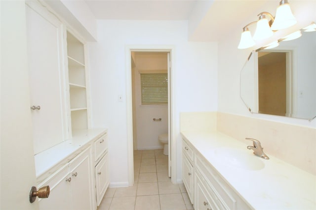 1110 Holly Dr, Conroe, TX 77301 - bathroom with toilet, tile patterned flooring, and vanity