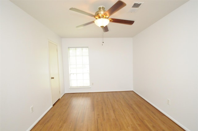 1110 Holly Dr, Conroe, TX 77301 - unfurnished room with baseboards, ceiling fan, visible vents, and light wood-style flooring