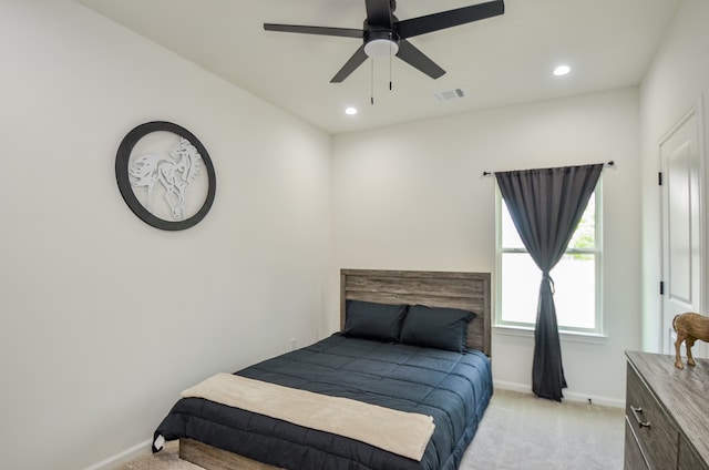 bedroom with light colored carpet, baseboards, recessed lighting, and a ceiling fan