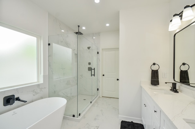 full bathroom with marble tiled flooring, a marble finish shower, recessed lighting, a soaking tub, and double vanity