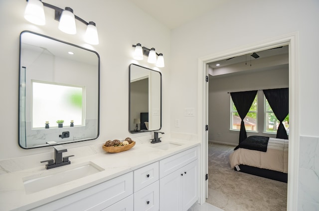 full bathroom featuring double vanity and connected bathroom